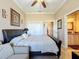 Bright bedroom with king bed, sitting area, and en-suite bathroom at 164 Sunrise Hill Ln, Auburndale, FL 33823