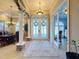 Spacious foyer with high ceilings, columns, and views to dining area at 164 Sunrise Hill Ln, Auburndale, FL 33823