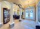 Bright and airy foyer with high ceilings and decorative columns at 164 Sunrise Hill Ln, Auburndale, FL 33823