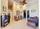 Spacious game room with seating area and views into other rooms at 164 Sunrise Hill Ln, Auburndale, FL 33823