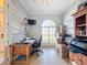 Bright home office features built-in shelving and a spacious desk at 164 Sunrise Hill Ln, Auburndale, FL 33823