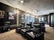 Home theater room with large screen and comfortable seating at 164 Sunrise Hill Ln, Auburndale, FL 33823