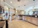 Open kitchen with an island and stainless steel appliances at 164 Sunrise Hill Ln, Auburndale, FL 33823
