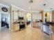 Open kitchen with an island and stainless steel appliances at 164 Sunrise Hill Ln, Auburndale, FL 33823