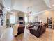 Spacious living room with a fireplace and leather furniture at 164 Sunrise Hill Ln, Auburndale, FL 33823