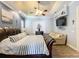 Main bedroom with king bed, sitting area, and TV at 164 Sunrise Hill Ln, Auburndale, FL 33823