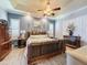 Spacious main bedroom with large bed and wood dresser at 164 Sunrise Hill Ln, Auburndale, FL 33823