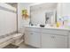 Bathroom with a double vanity, shower, and a view to an adjacent bedroom at 3200 Canna Lily Pl, Clermont, FL 34711