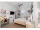 Cozy bedroom with white furniture, a ceiling fan, and decor at 3200 Canna Lily Pl, Clermont, FL 34711