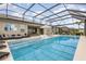 A gorgeous in-ground pool with a screened-in lanai and plenty of room for entertaining at 3200 Canna Lily Pl, Clermont, FL 34711