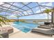 Screened-in pool with unobstructed lake views, offering a private oasis at 3200 Canna Lily Pl, Clermont, FL 34711
