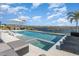 Stunning infinity pool overlooking serene lake views, perfect for relaxation and entertainment at 3200 Canna Lily Pl, Clermont, FL 34711