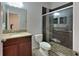 Bathroom with granite countertop and walk-in shower at 3537 Raleigh Dr, Winter Haven, FL 33884