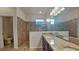 Bathroom with double vanity, granite countertop and walk-in shower at 3537 Raleigh Dr, Winter Haven, FL 33884