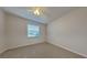 Bright bedroom with carpeted floor and window blinds at 3537 Raleigh Dr, Winter Haven, FL 33884