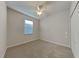 Bright bedroom with ceiling fan and carpet flooring at 3537 Raleigh Dr, Winter Haven, FL 33884