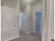 A long hallway with neutral walls and carpet flooring at 3537 Raleigh Dr, Winter Haven, FL 33884