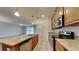 Open kitchen with granite countertops and stainless steel appliances at 3537 Raleigh Dr, Winter Haven, FL 33884