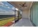 Screened porch overlooking backyard with ceiling fan at 3537 Raleigh Dr, Winter Haven, FL 33884