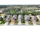 Five homes in a row with attached garages and landscaping at 108 La Cresta Ct, Davenport, FL 33837