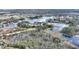 Home nestled near a lake with wooded surroundings at 108 La Cresta Ct, Davenport, FL 33837