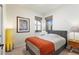Bedroom with gray bed, orange throw, and mid-century modern nightstands at 108 La Cresta Ct, Davenport, FL 33837