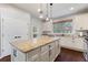 Kitchen with granite countertops and white cabinets at 108 La Cresta Ct, Davenport, FL 33837