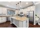 Modern kitchen with granite countertops and stainless steel appliances at 108 La Cresta Ct, Davenport, FL 33837
