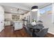 Bright kitchen with granite island, stainless steel appliances, and white cabinets at 108 La Cresta Ct, Davenport, FL 33837