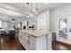 Kitchen features granite island and white cabinets at 108 La Cresta Ct, Davenport, FL 33837