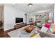 Spacious living room featuring hardwood floors and comfortable seating at 108 La Cresta Ct, Davenport, FL 33837