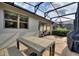 Outdoor patio with table, chairs, and grill at 108 La Cresta Ct, Davenport, FL 33837