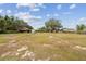 Large grassy backyard with storage shed at 2028 Marker Rd, Polk City, FL 33868