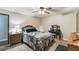 Cozy bedroom with a double bed, ceiling fan, and plenty of natural light at 2028 Marker Rd, Polk City, FL 33868