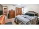 Primary bedroom with large bed and dresser at 2028 Marker Rd, Polk City, FL 33868