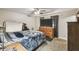 Bright bedroom featuring a comfy bed, dresser, and large TV at 2028 Marker Rd, Polk City, FL 33868