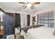 Well-lit bedroom with a queen bed and ample closet space at 2028 Marker Rd, Polk City, FL 33868