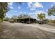 Covered carport with space for multiple vehicles at 2028 Marker Rd, Polk City, FL 33868