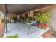 Relaxing covered patio with seating area and plants at 2028 Marker Rd, Polk City, FL 33868