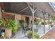 Covered patio features seating and lush greenery at 2028 Marker Rd, Polk City, FL 33868