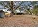 Home with a large oak tree and side yard at 2028 Marker Rd, Polk City, FL 33868