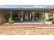 Inviting front porch with covered seating area at 2028 Marker Rd, Polk City, FL 33868