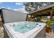 Relaxing hot tub with a covered patio nearby at 2028 Marker Rd, Polk City, FL 33868