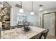 Kitchen island with breakfast bar seating, overlooking dining area at 2028 Marker Rd, Polk City, FL 33868