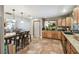 Eat-in kitchen with island seating and view into dining area at 2028 Marker Rd, Polk City, FL 33868
