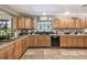 Modern kitchen with granite countertops and appliances at 2028 Marker Rd, Polk City, FL 33868