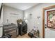Convenient laundry room with washer, dryer, and storage at 2028 Marker Rd, Polk City, FL 33868