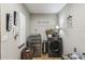 Bright laundry room, featuring a washer and dryer, and built in storage at 2028 Marker Rd, Polk City, FL 33868