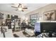 Home office with a desk, comfortable seating, and built-in shelving at 2028 Marker Rd, Polk City, FL 33868