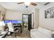 Bright office space with a desk, comfortable seating, and views of the backyard at 2028 Marker Rd, Polk City, FL 33868